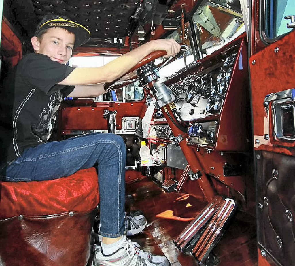 BIG DREAMS: Damien Gill 12 of Grafton dreams of being behind the wheel of Scott McSweeney’s T900. BIG DREAMS: Damien Gill 12 of Grafton dreams of being behind the wheel of Scott McSweeney’s T900.